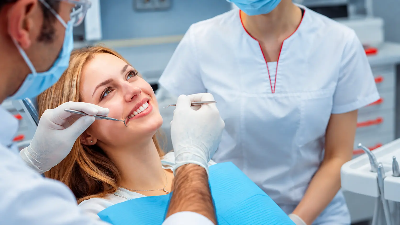 A patient smiling during a dental check-up at Four Star Medical Center